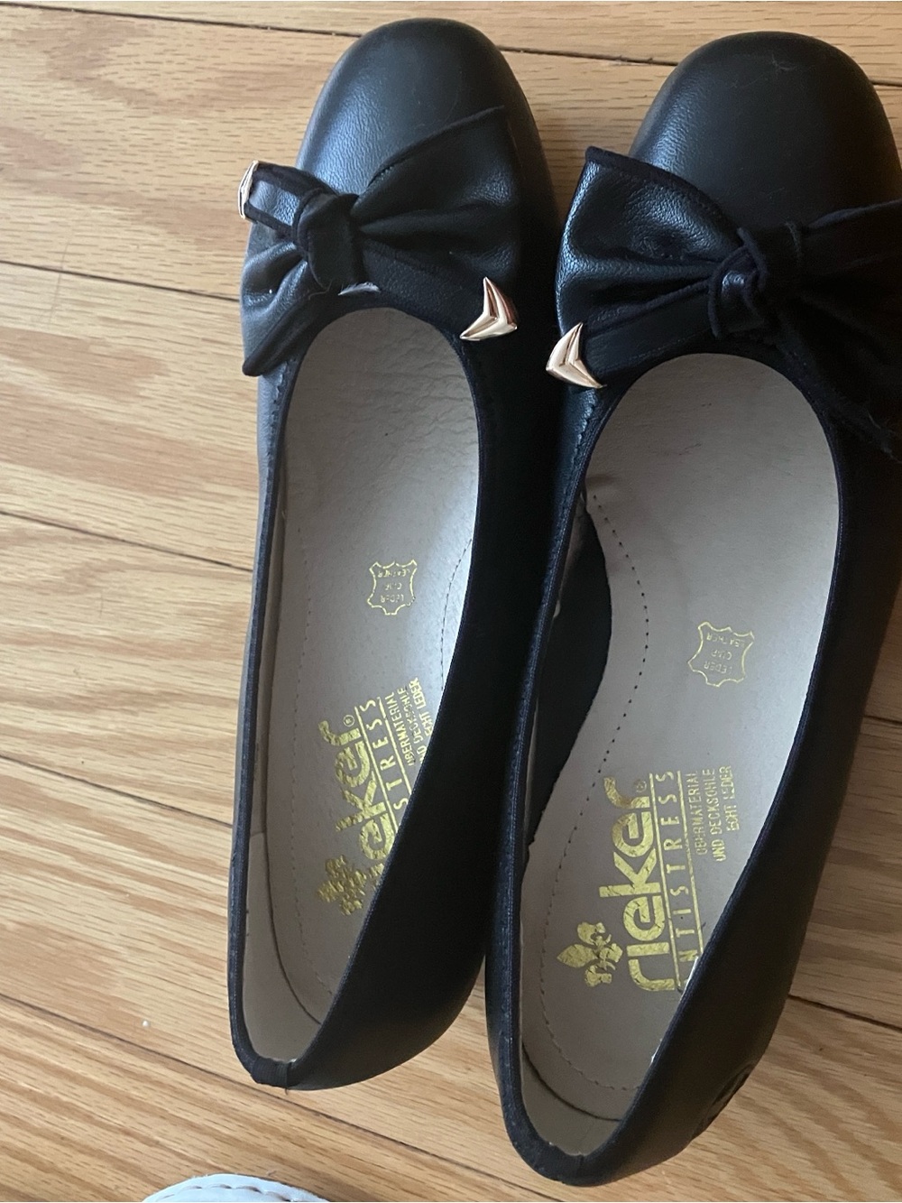 Rieker Black Bow Ballet Flats with Gold Accents
